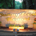 The Sunny rest resort entrance sign